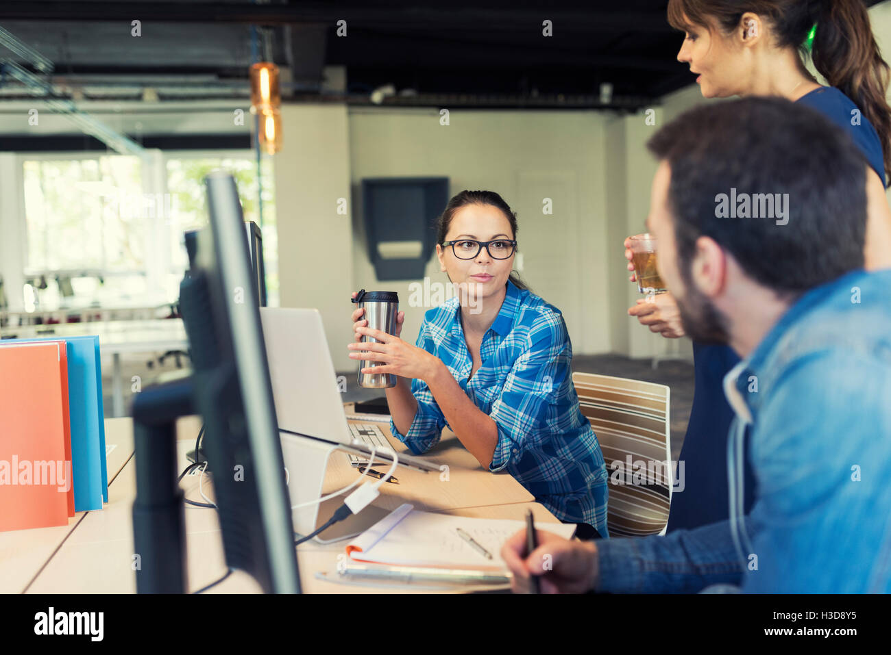 Business team in a meeting. Office workers discussing  in modern startup Stock Photo