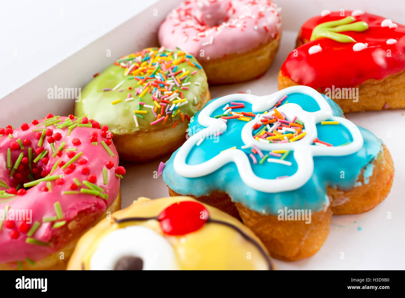 Six delicious and colorful donuts Stock Photo - Alamy