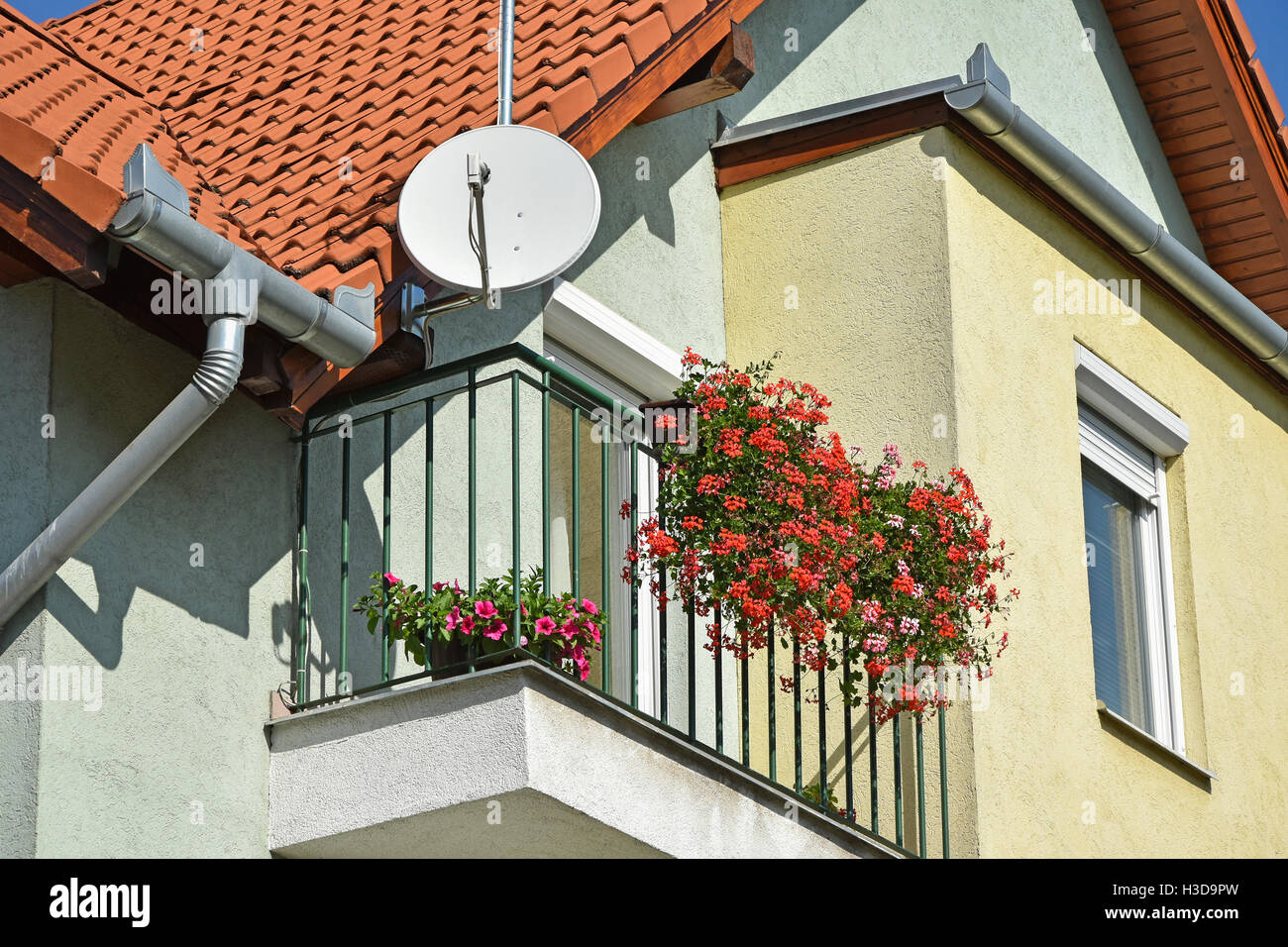 Part of a house with parabolic antenna Stock Photo - Alamy
