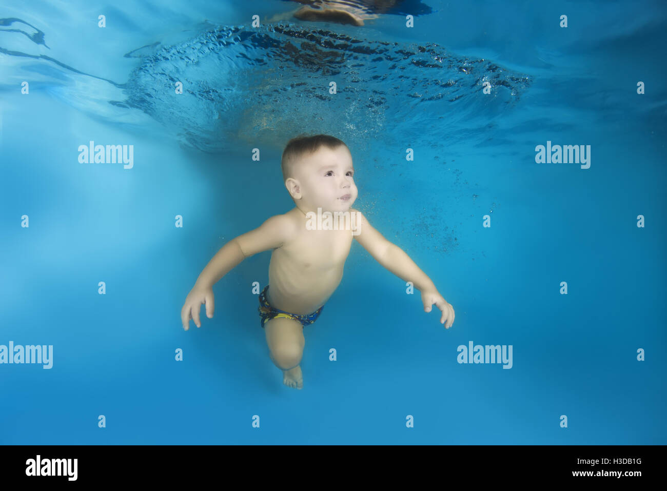 2 years boy learning to swim underwater in the pool, Odessa, Ukraine