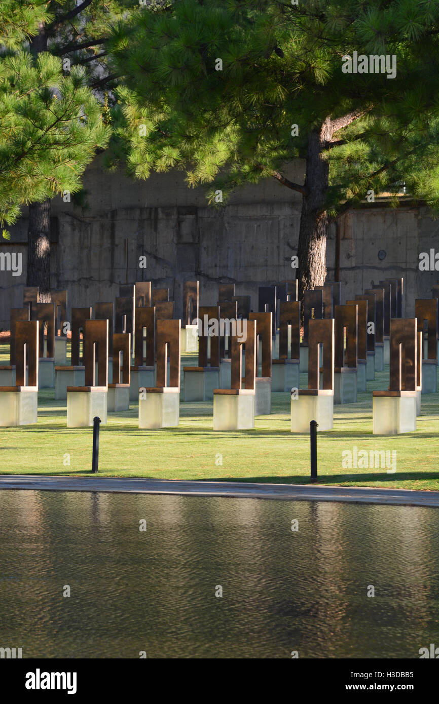 A field of empty chairs with smaller ones for the children represent ...