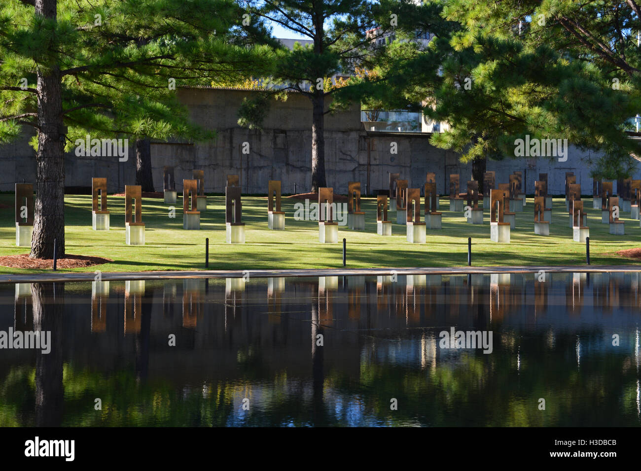 A field of empty chairs with smaller ones for the children represent ...