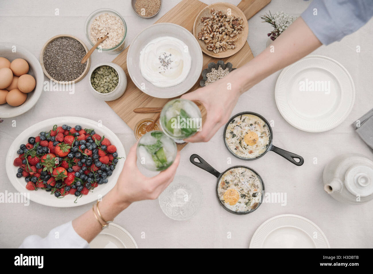 Breakfast fruit, berries and yoghurt, eggs and cooked omelettes. Two