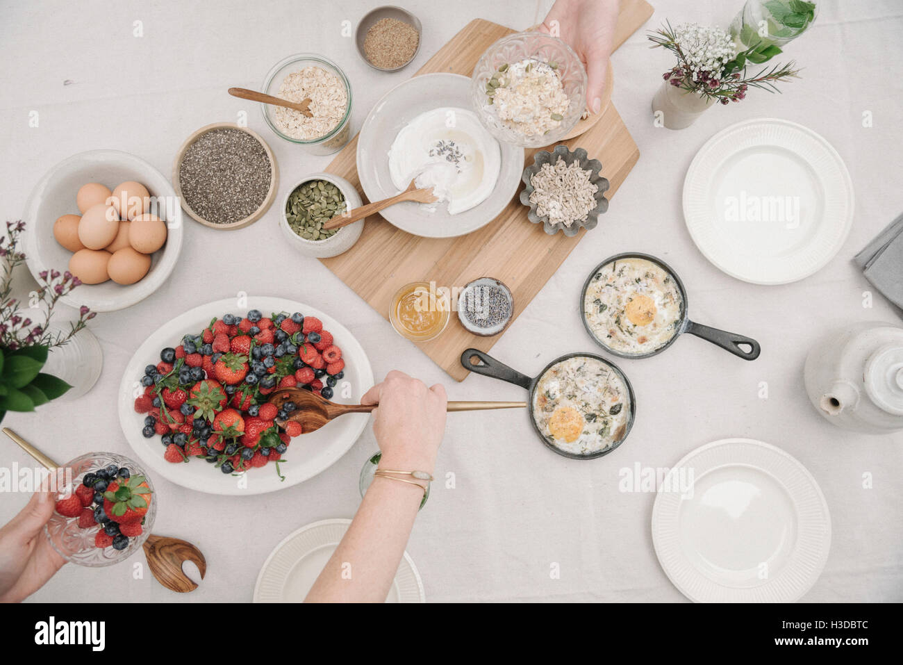 Overhead view of a table with food in dishes. Breakfast, berries and