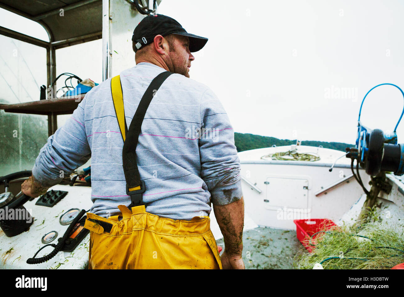 Fisherman driving a boat hi-res stock photography and images - Alamy