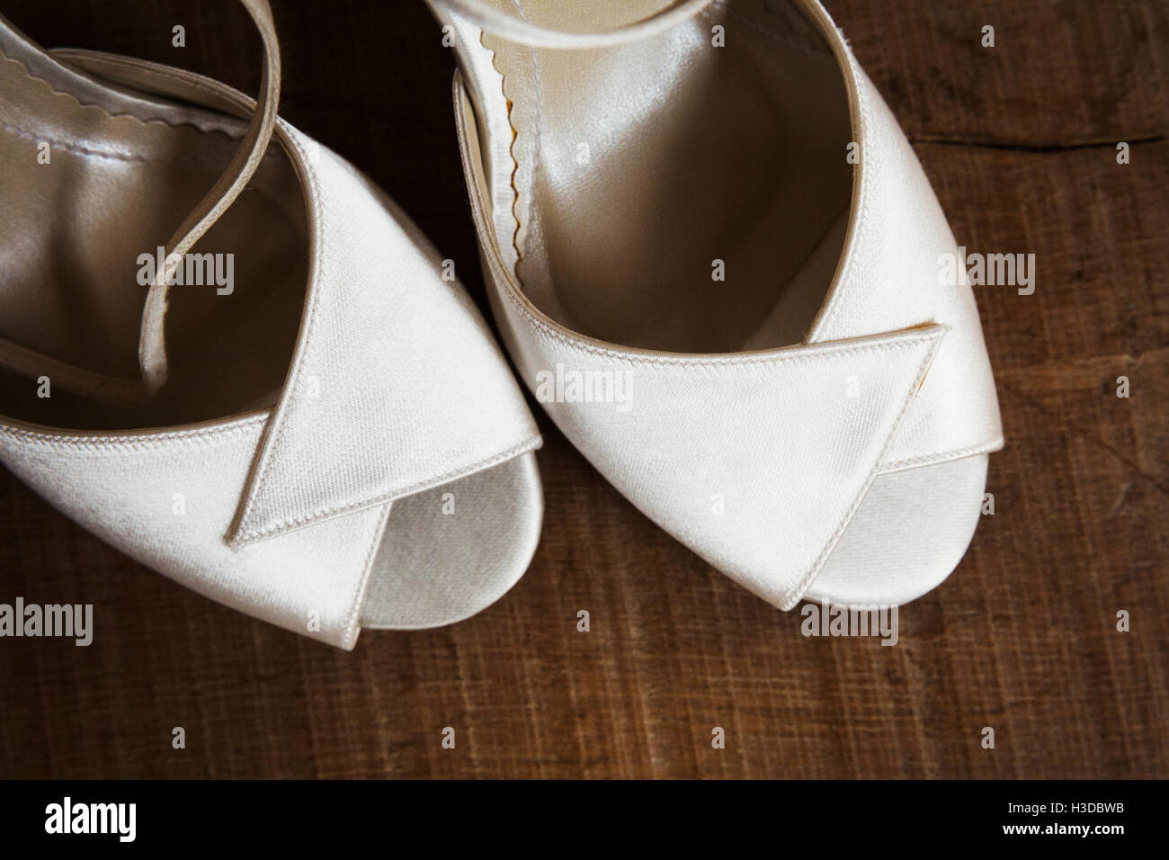 A pair of white peep toed shoes. Close up of wedding shoes Stock Photo Alamy