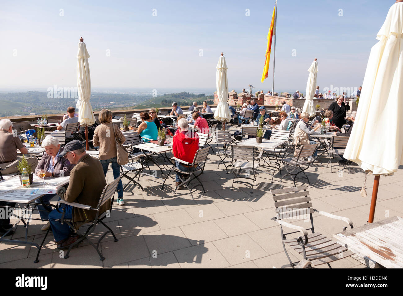 Outdoor patio with people at  Markgraf von Baden Schloss,Castle in Southern Germany, Europe,Schloss Staufenberg Winery,Durbach Stock Photo