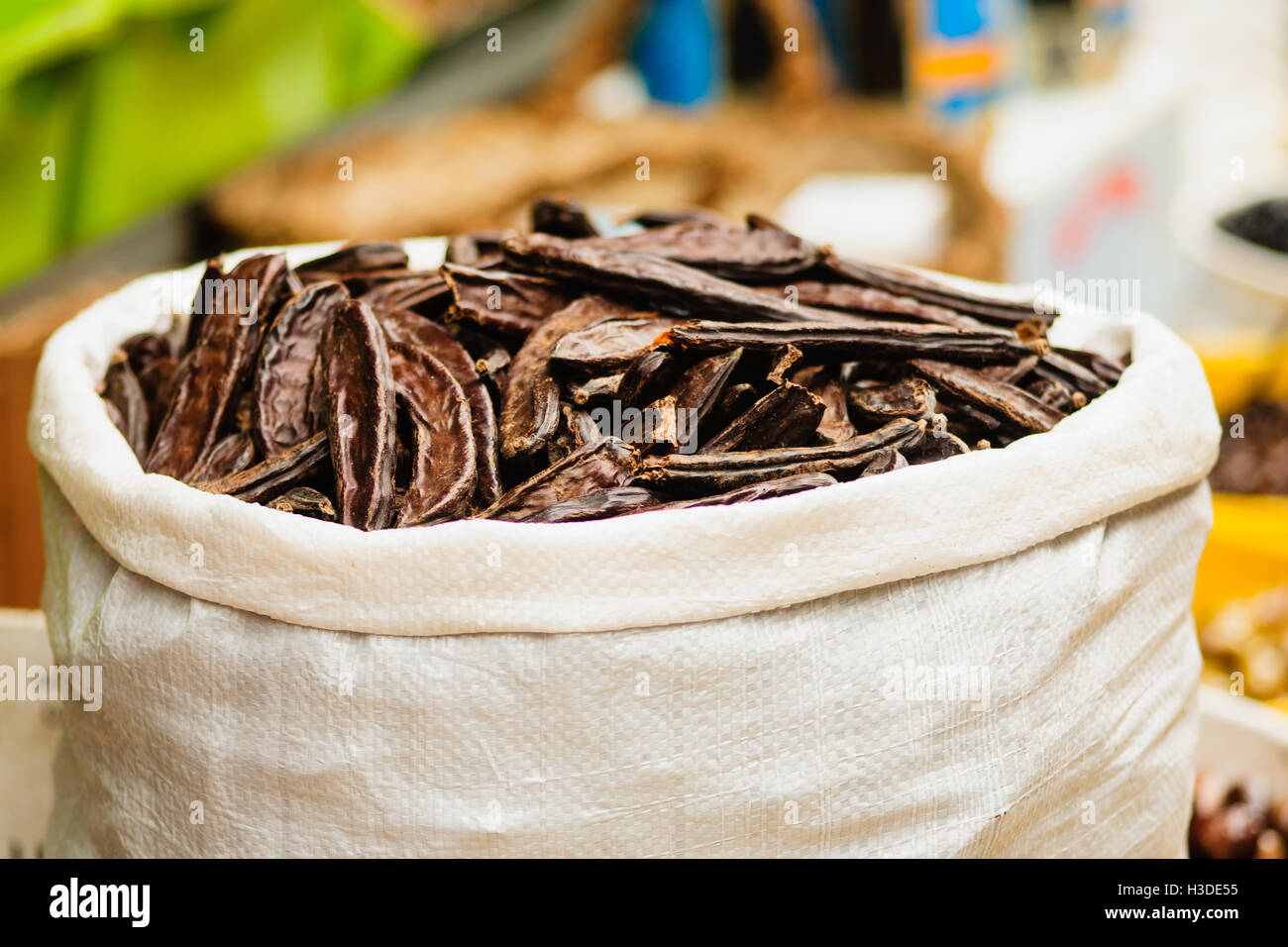 Carob pods on sale in the market Stock Photo