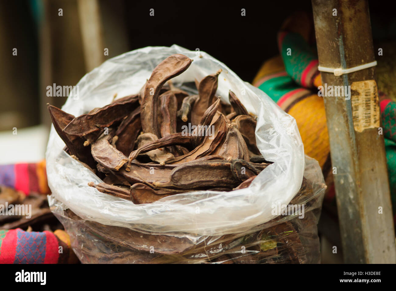 Carob pods on sale in the market Stock Photo Alamy