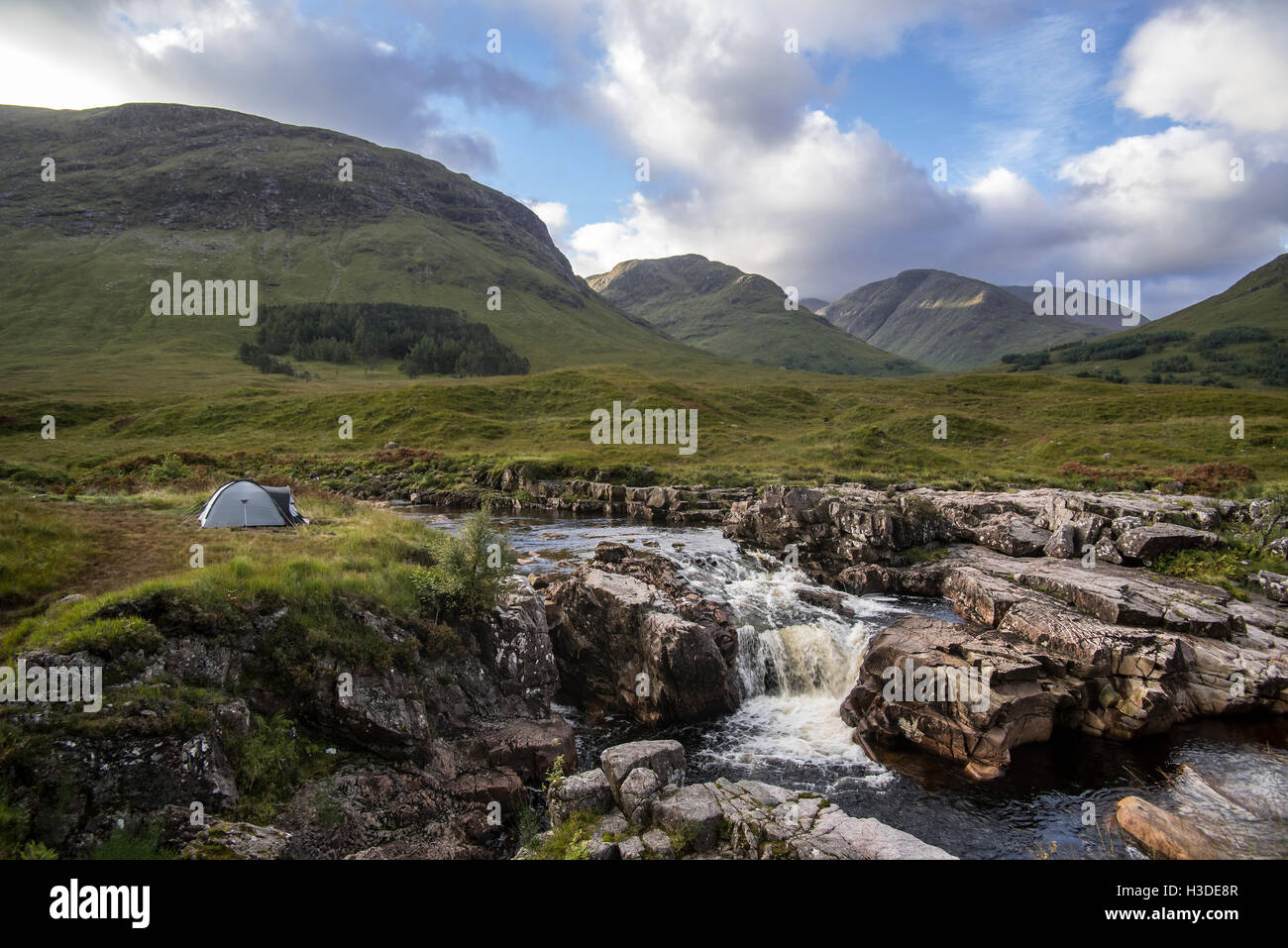 Wild camping with lightweight dome tent along the River Etive in Glen Etive near Glencoe in the Scottish Highlands, Scotland, UK Stock Photo