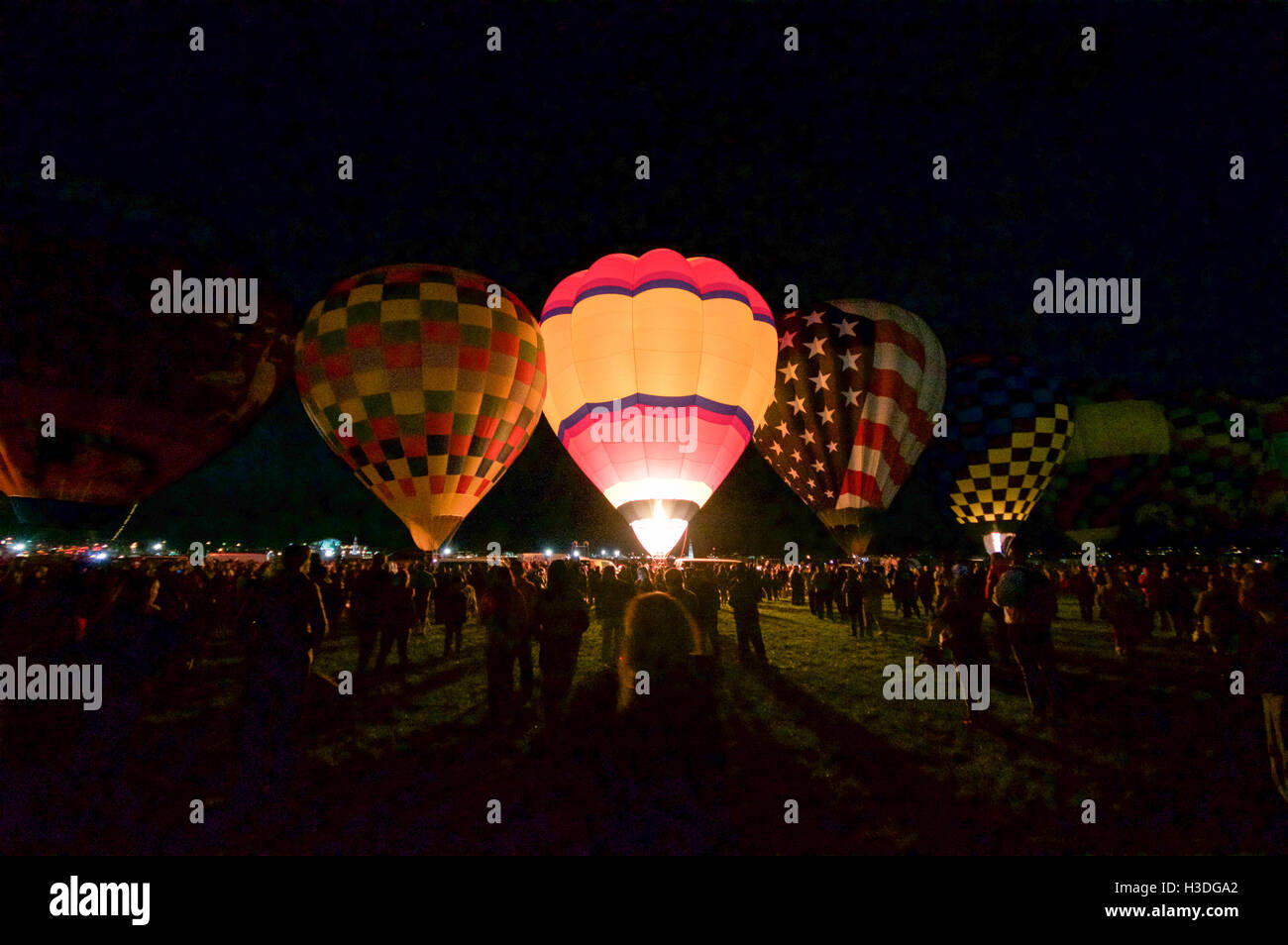 Hot air balloons prepare to go into the sky at dawn at the Albuquerque International Balloon Fiesta in New Mexico, October 2016. Stock Photo