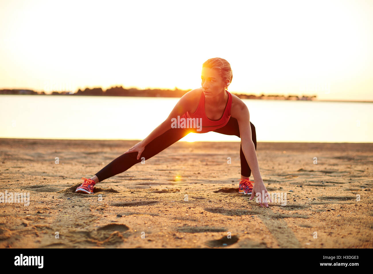 A young athletic woman working out outdoors. Stock Photo