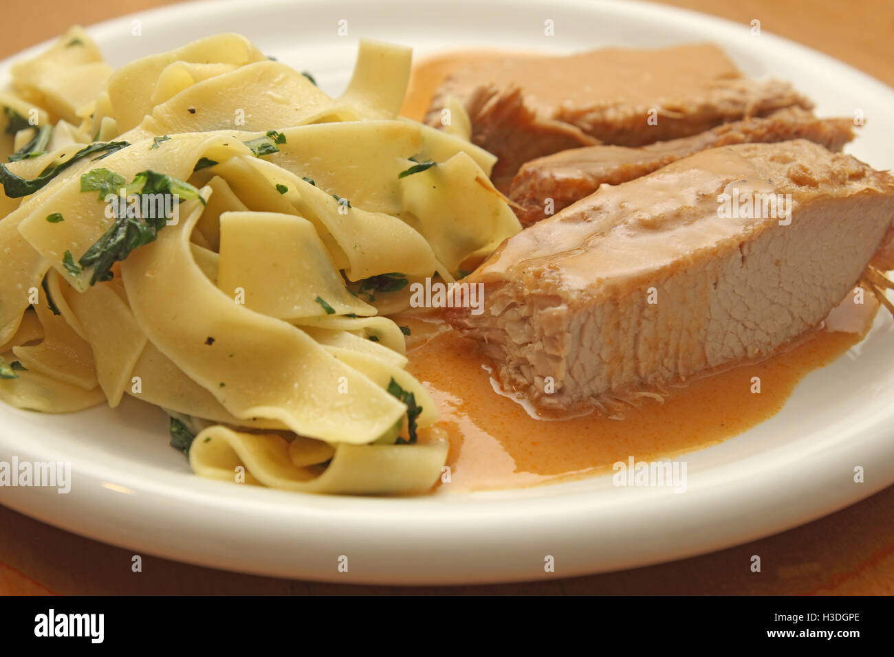 Veal roast with Tagliatelle noodles Stock Photo