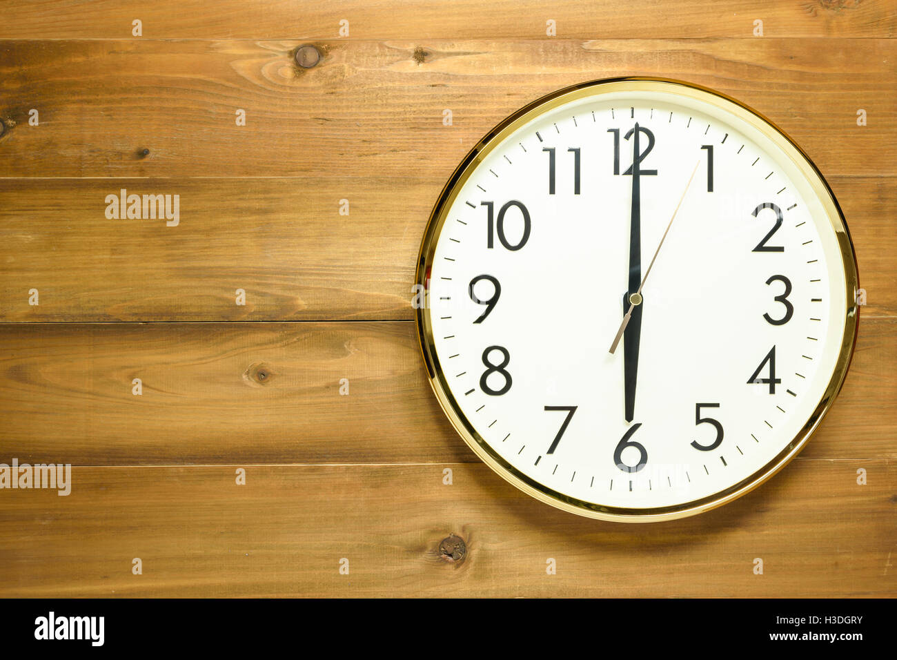 wall clock on the wooden wall at 6am or 6pm Stock Photo - Alamy
