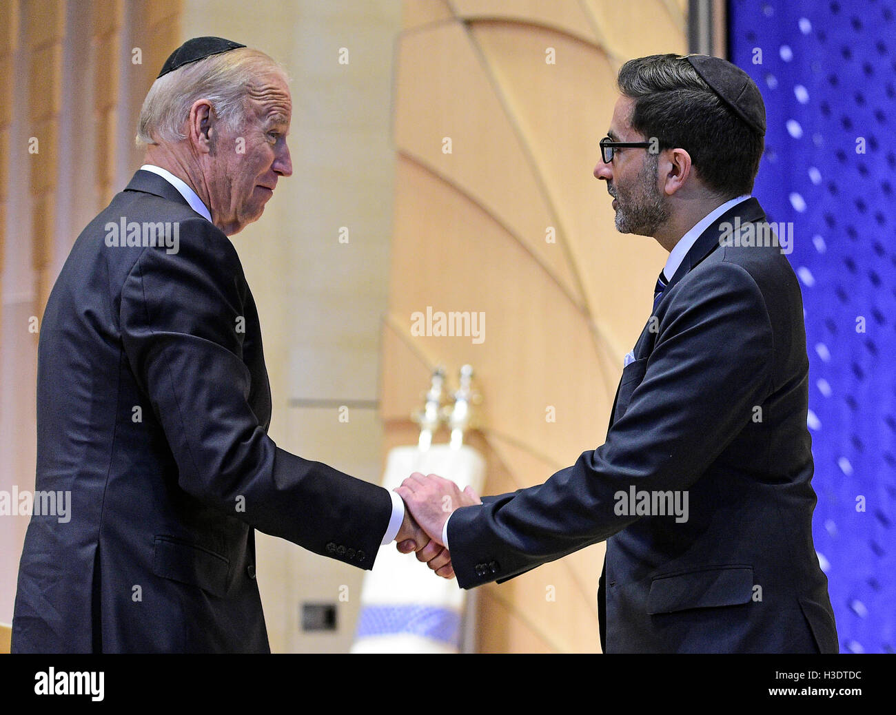 United States Vice President Joe Biden is welcomed by Rabbi Gil Steinlauf of Adas Israel Congregation prior to making remarks at the official National Memorial Service for Shimon Peres in the synagogue in Washington, DC on October 6, 2016.   Credit: Ron Sachs / CNP /MediaPunch Stock Photo