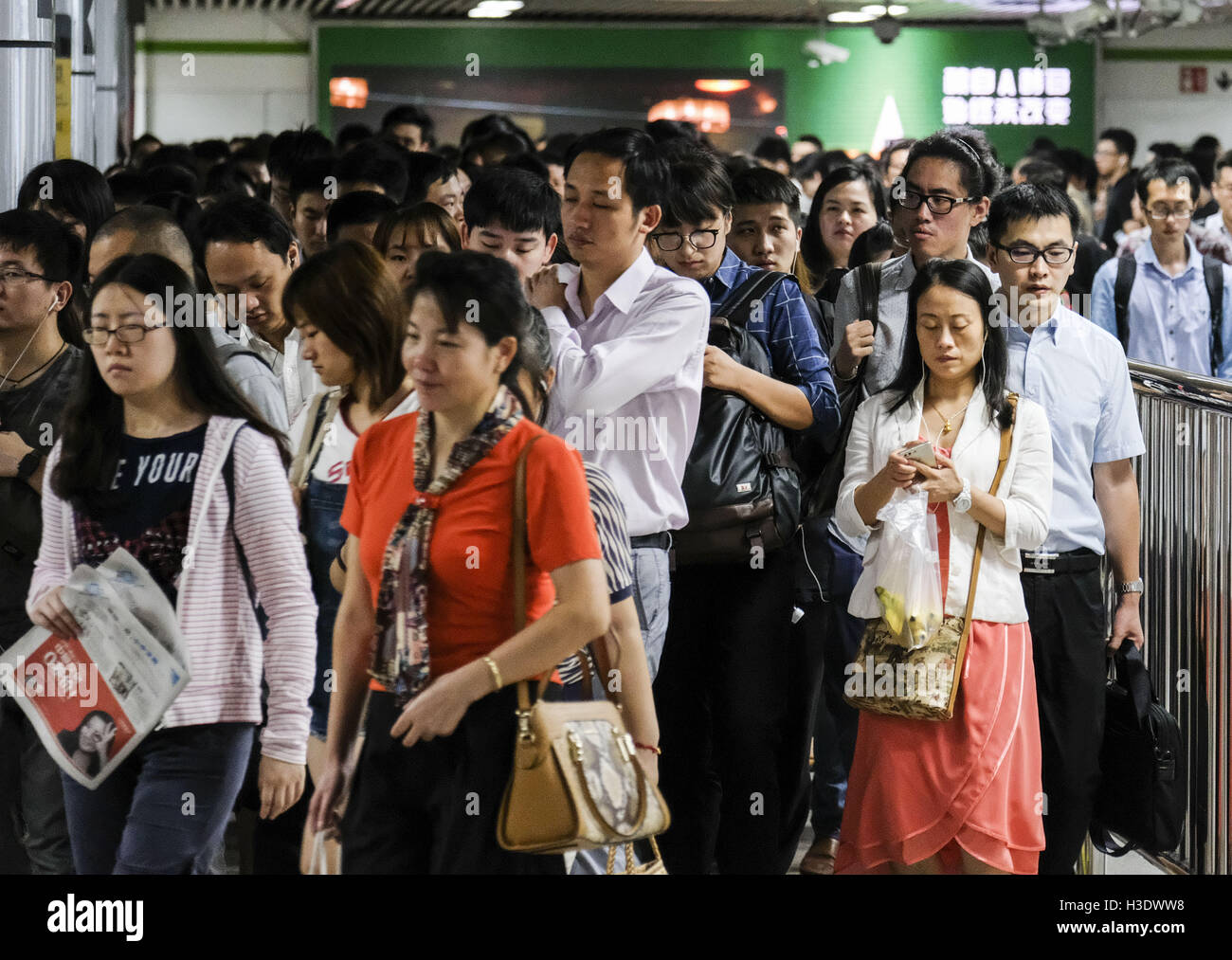 September 11, 2016 - Los Angeles, California, U.S - People rush to work and school at subway station on Monday morning in Shanghai, China. Shanghai is the most populous city in China and the most populous city proper in the world. It is one of the four direct-controlled municipalities of China, with a population of more than 24 million as of 2014. It is a global financial centre, and a transport hub with the world's busiest container port. Located in the Yangtze River Delta in East China, Shanghai sits on the south edge of the mouth of the Yangtze in the middle portion of the Chinese coast. Th Stock Photo