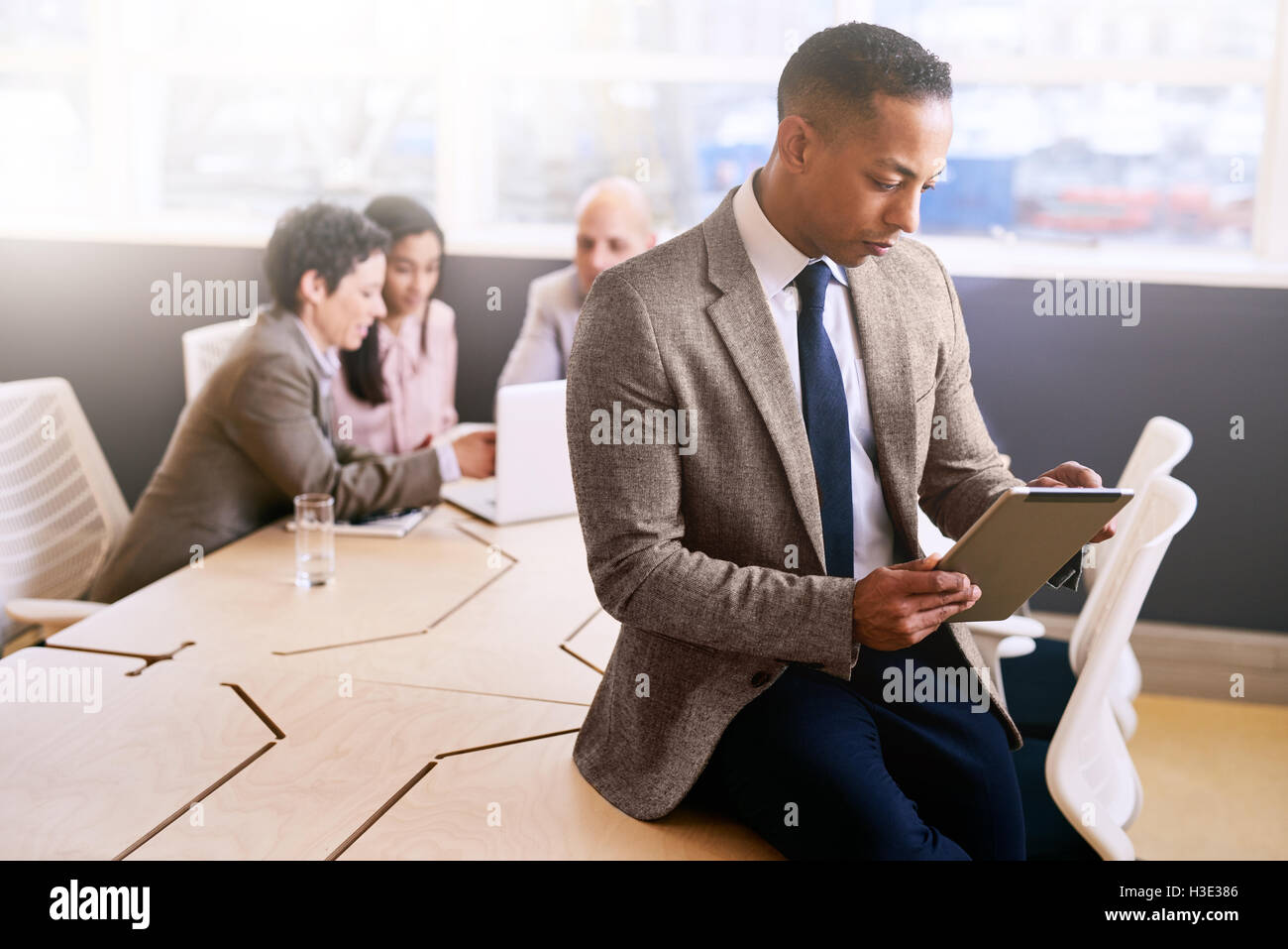 Seated behind him hi-res stock photography and images - Alamy