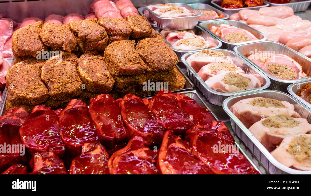 Variety of marinated meat at display counter Stock Photo Alamy