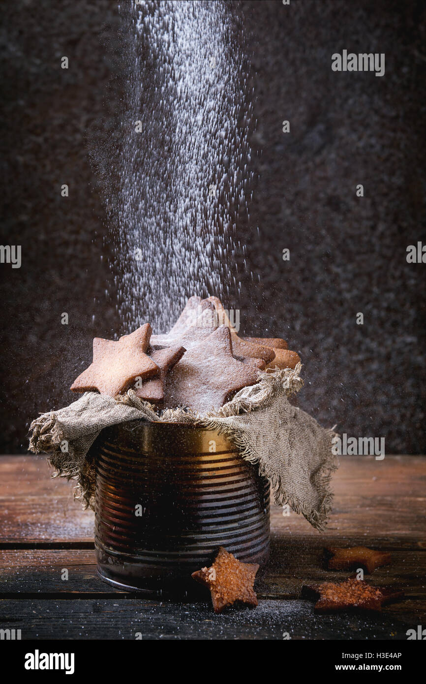 Homemade shortbread star shape sugar cookies different size in old tin ...