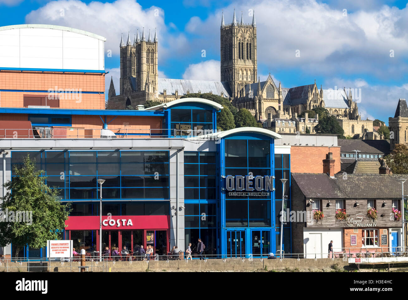 View of historic Lincoln Cathedral above modern buildings located on Brayford Pool, Lincoln, Lincolnshire, England UK Stock Photo