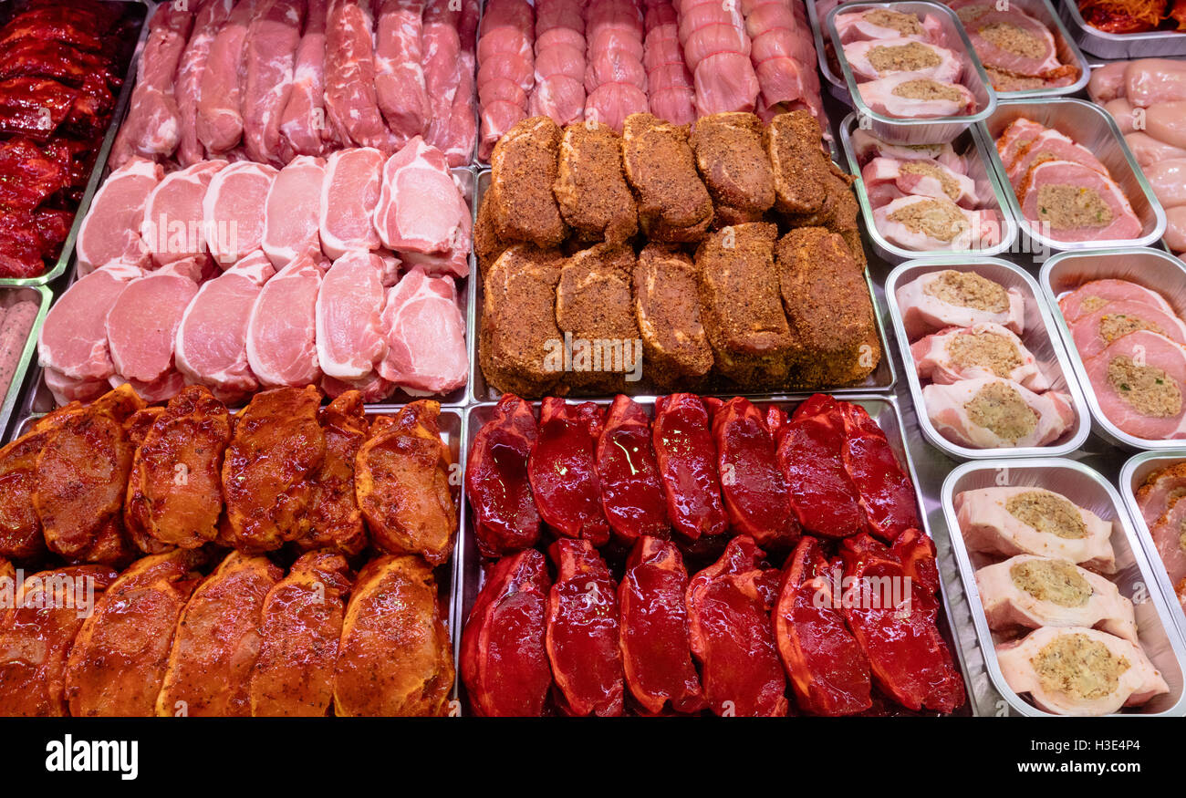 Variety of marinated meat at display counter Stock Photo Alamy