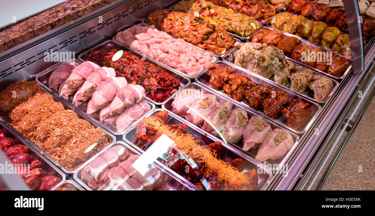 Variety of marinated meat at display counter Stock Photo Alamy