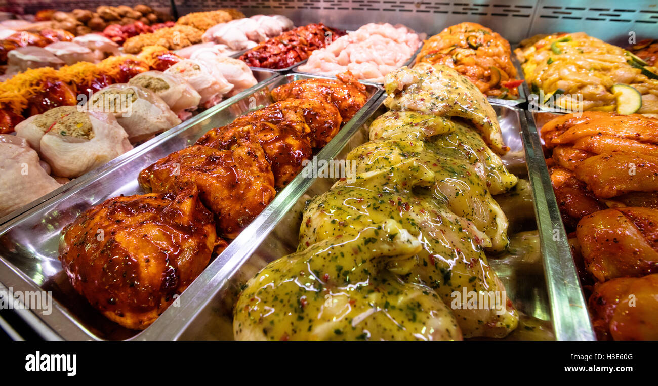 Variety of marinated meat at display counter Stock Photo Alamy