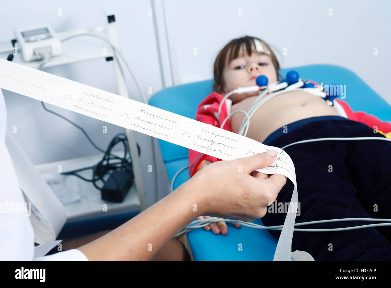 a Young woman doctor cardiologist makes a survey Stock Photo