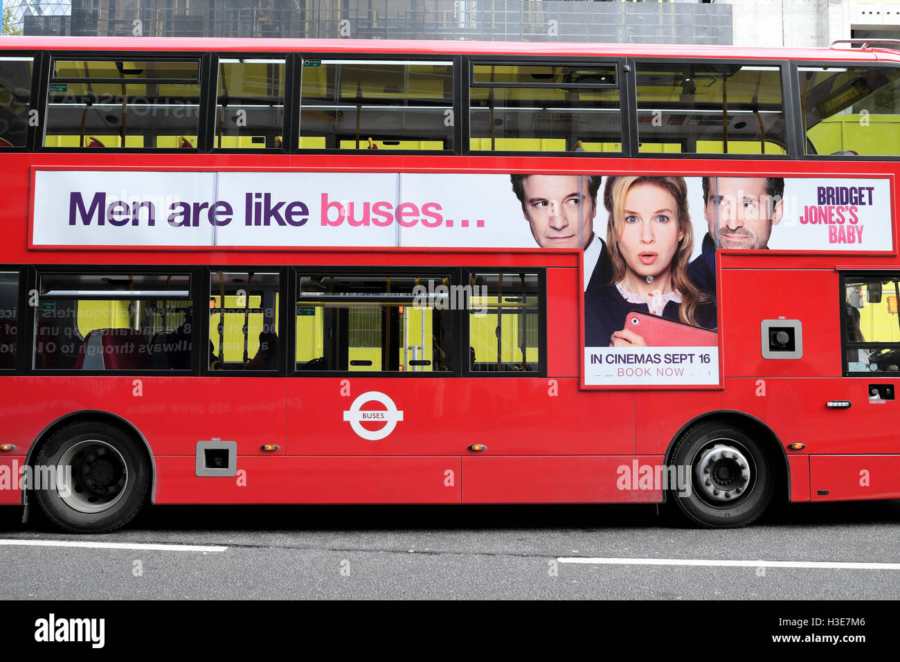 'Men are like buses'  Bridget Jones Baby film advert on the side of a red double-decker London bus UK  KATHY DEWITT Stock Photo