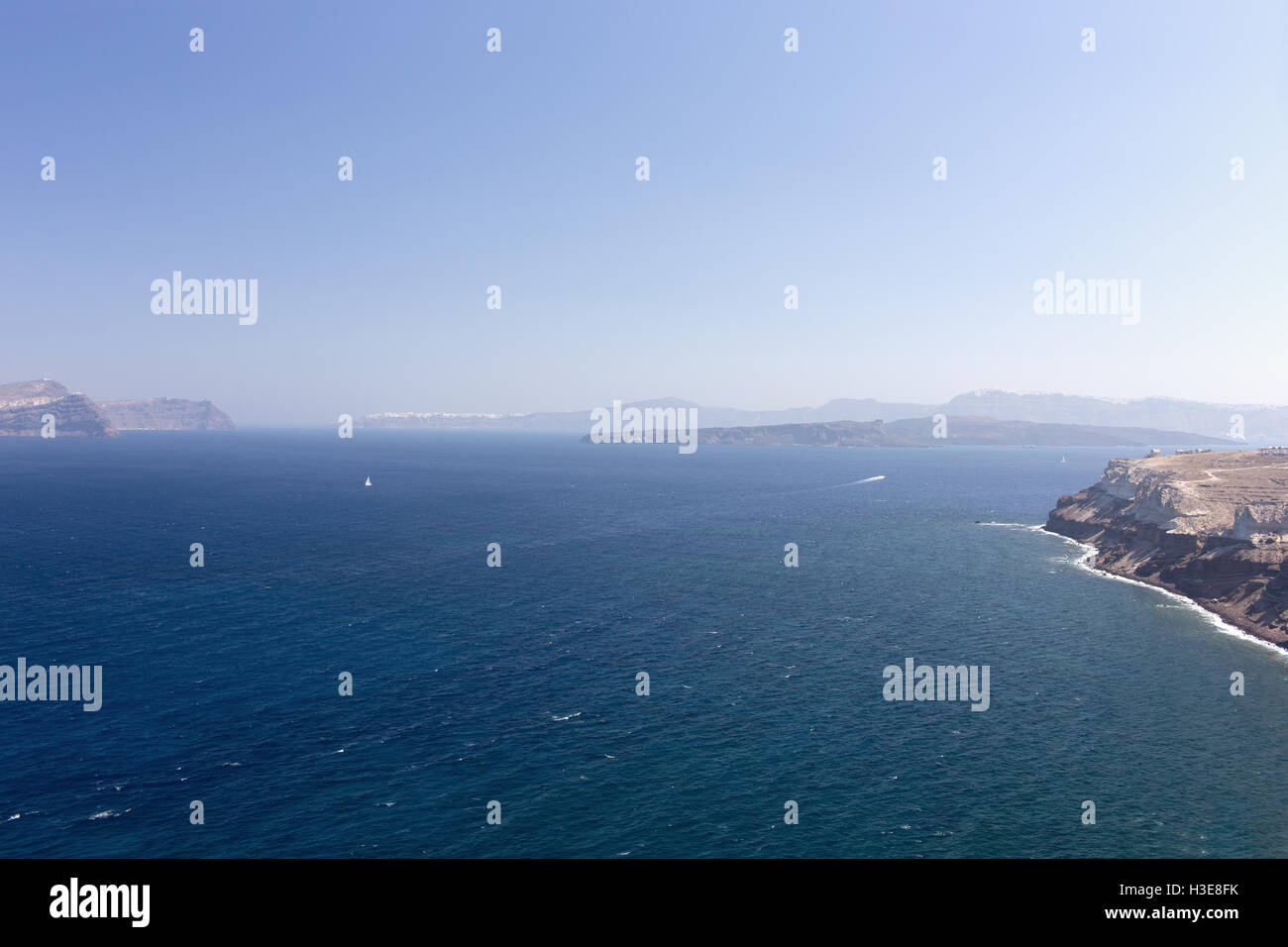 White sailing boat in the blue sea on a background of mountains Stock ...