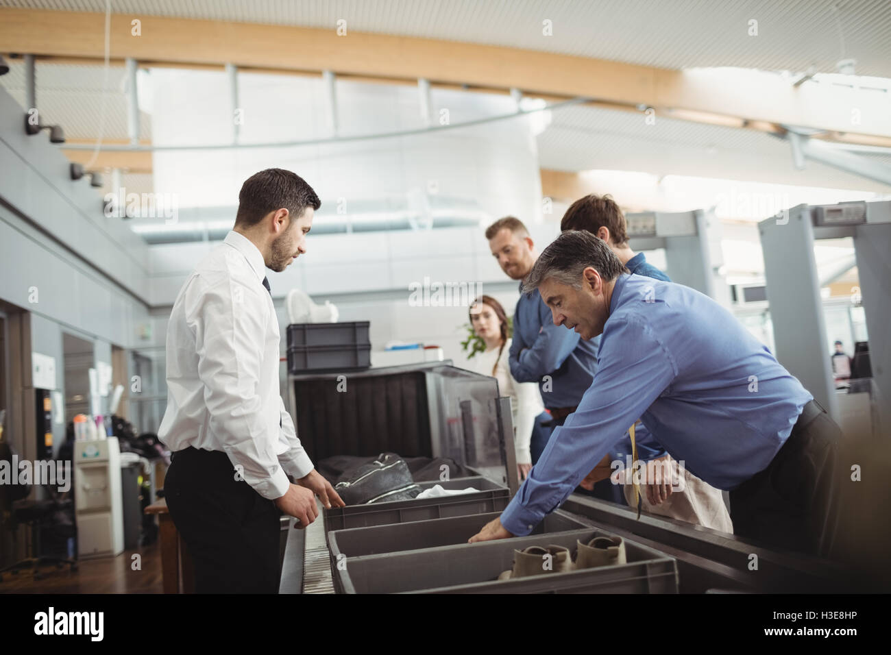 Passengers in airport security check Stock Photo