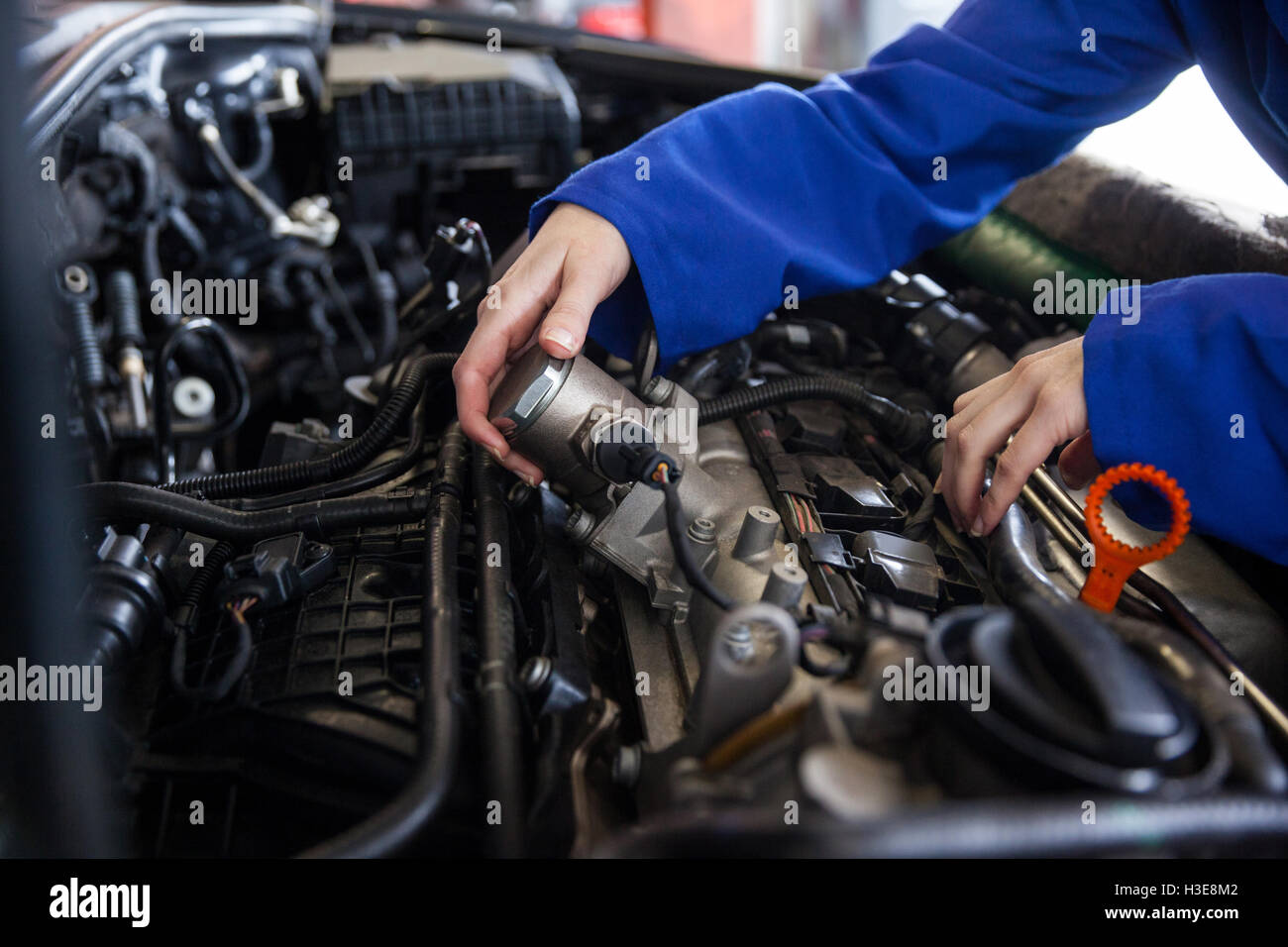 Mechanic servicing car engine Stock Photo Alamy