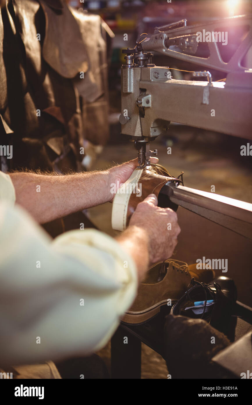 Shoemaker using sewing machine Stock Photo Alamy