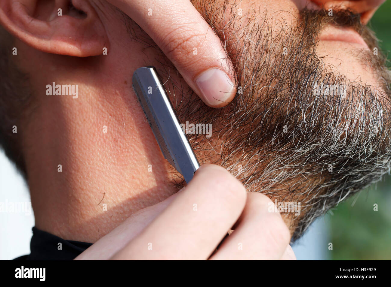 Master barber shears beard man close up Stock Photo
