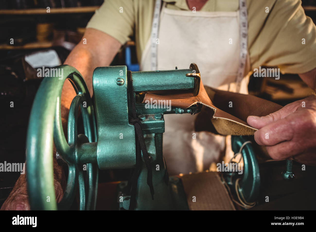 Shoemaker using sewing machine Stock Photo Alamy