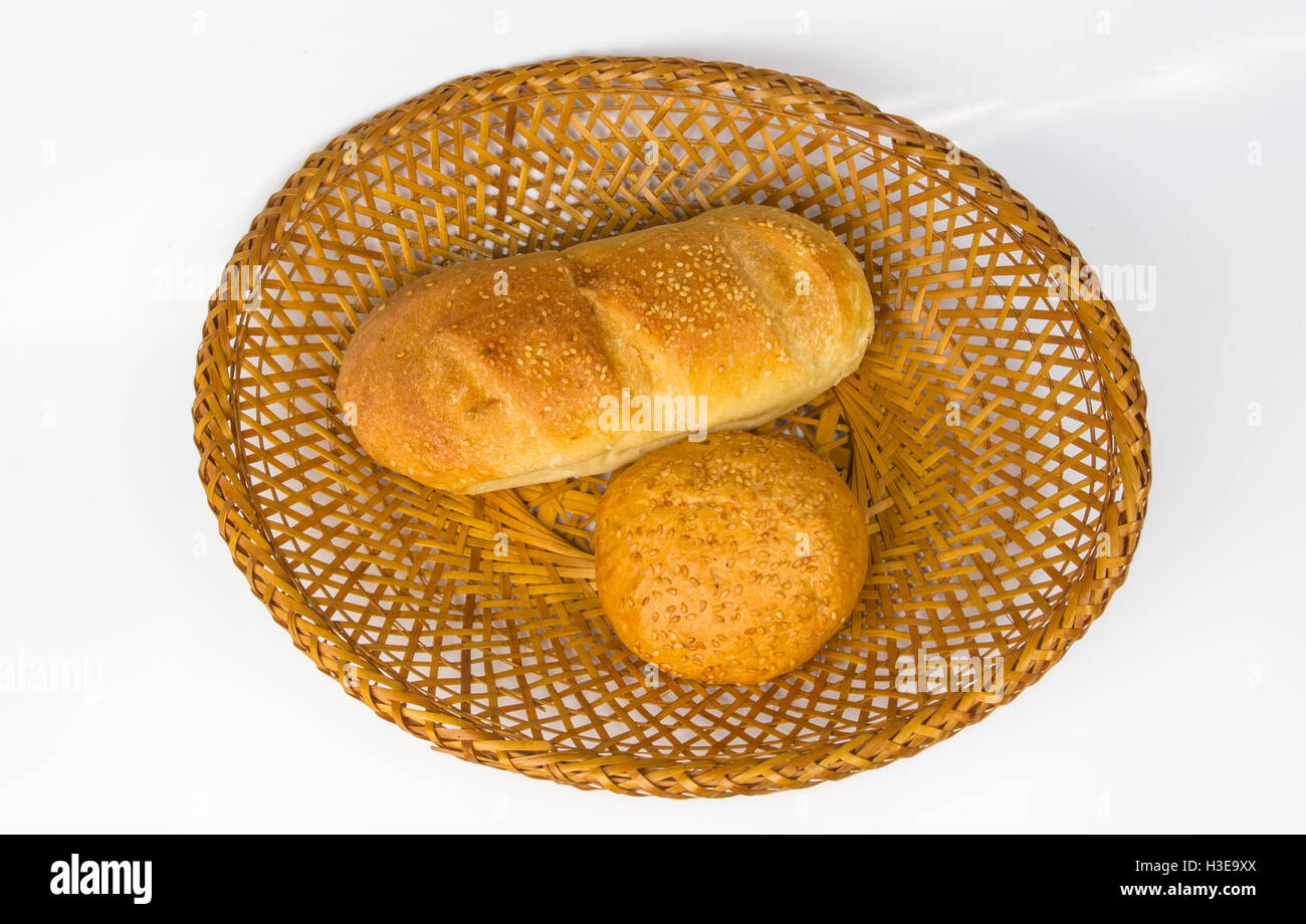 whole wheat bread and bun on a wicker plate Stock Photo - Alamy
