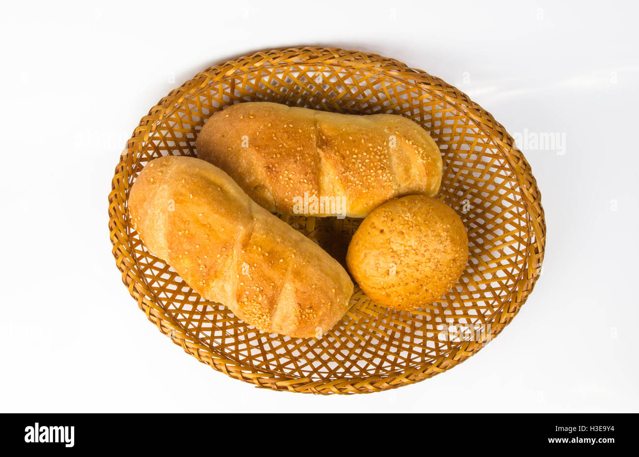 whole wheat breads and bun on a wicker plate Stock Photo - Alamy
