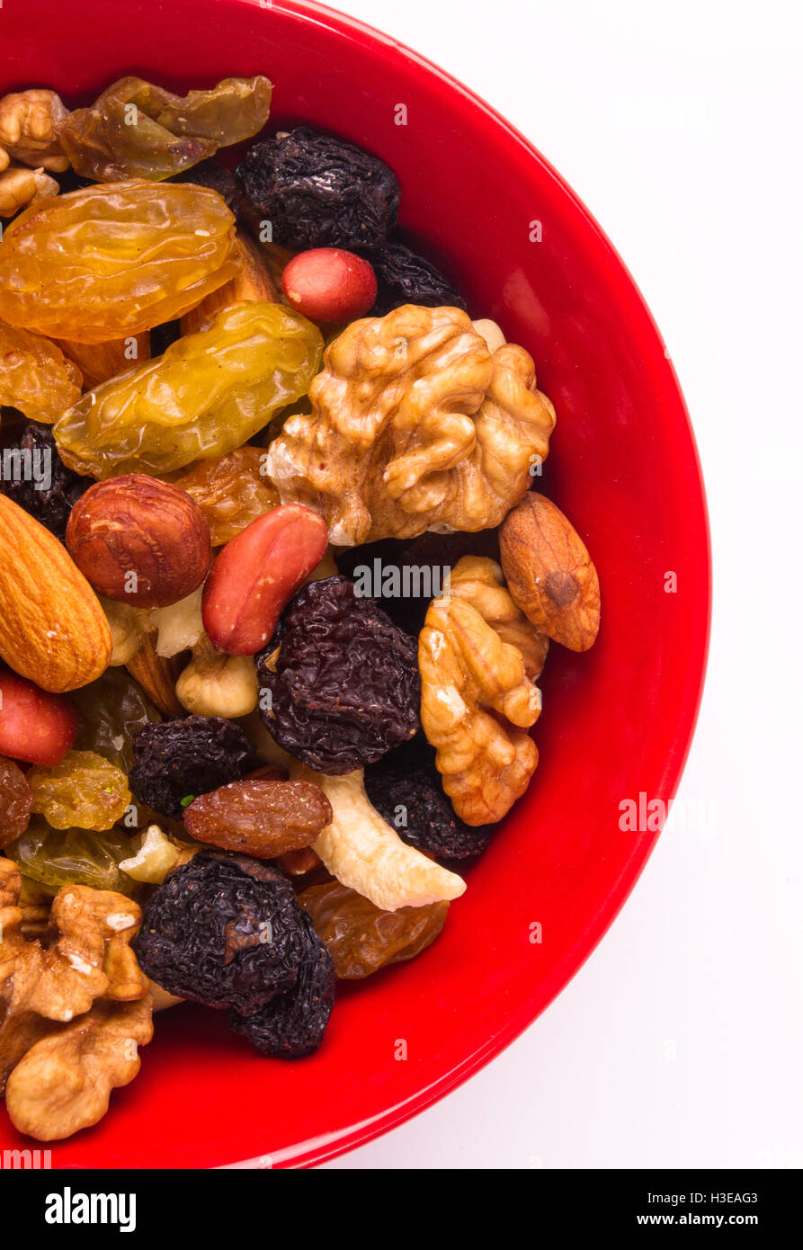 various different mixed nuts and raisins on white background Stock
