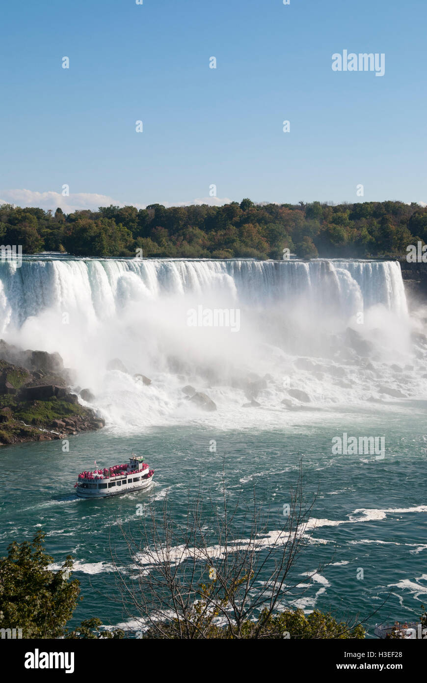 The Maid of the Mist approaches the American Falls as seen from the Canadian side of Niagara Falls Canada Stock Photo
