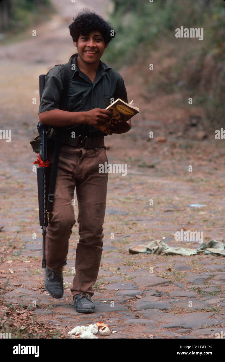 TENANCINGO,  EL SALVADOR, MARCH 1984: - Within the FPL Guerrilla's Zones of Control. A guerilla fighter with his book on outskirts of the town. Stock Photo