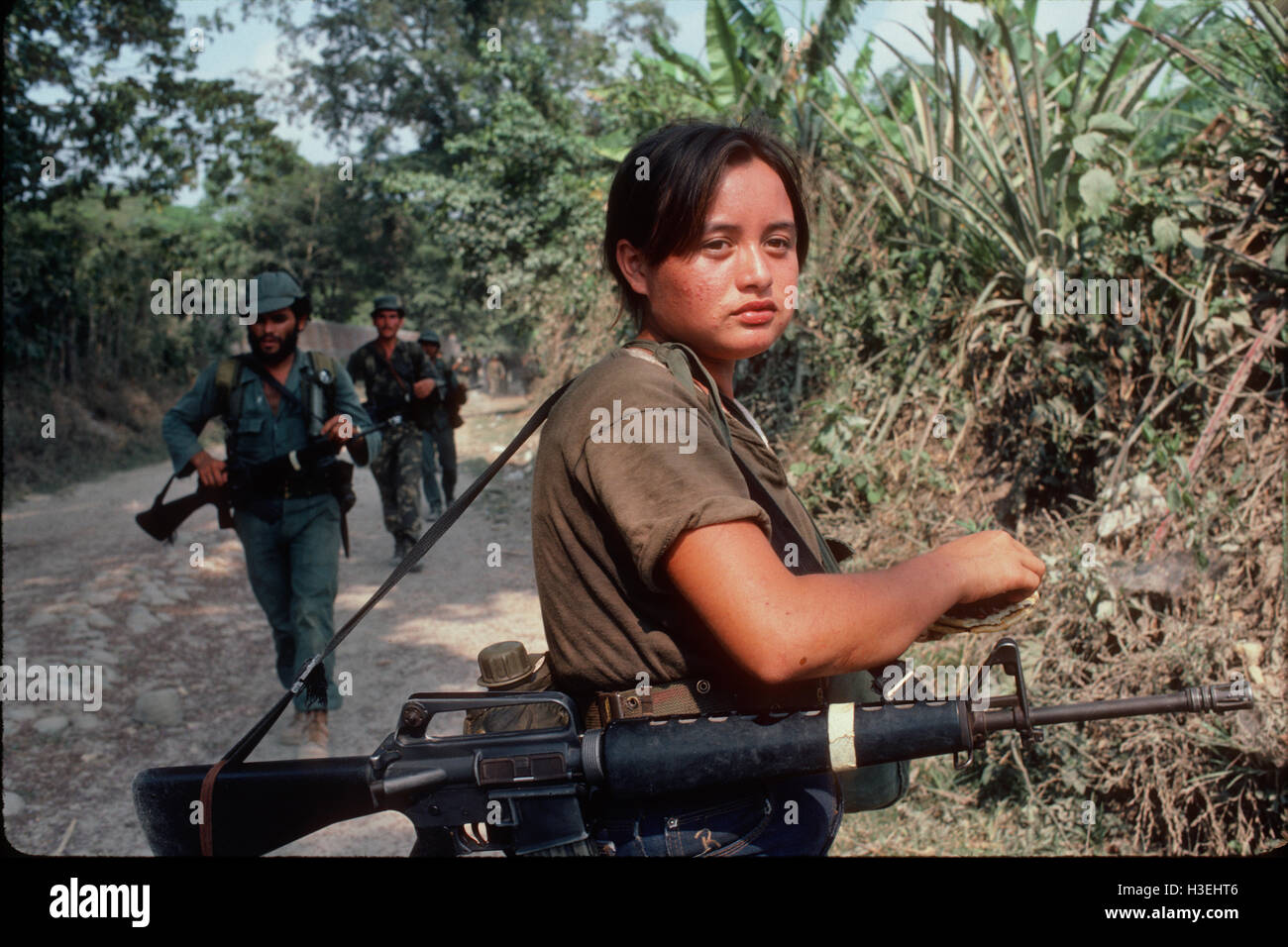 TENANCINGO,  EL SALVADOR, FEB 1984: - Within the FPL Guerrilla's Zones of Control - Some of the 1,000 guerillas that had been gathered in preparation for a guerrilla offensive, less than 40 miles from the capital, include woman combatants. Stock Photo