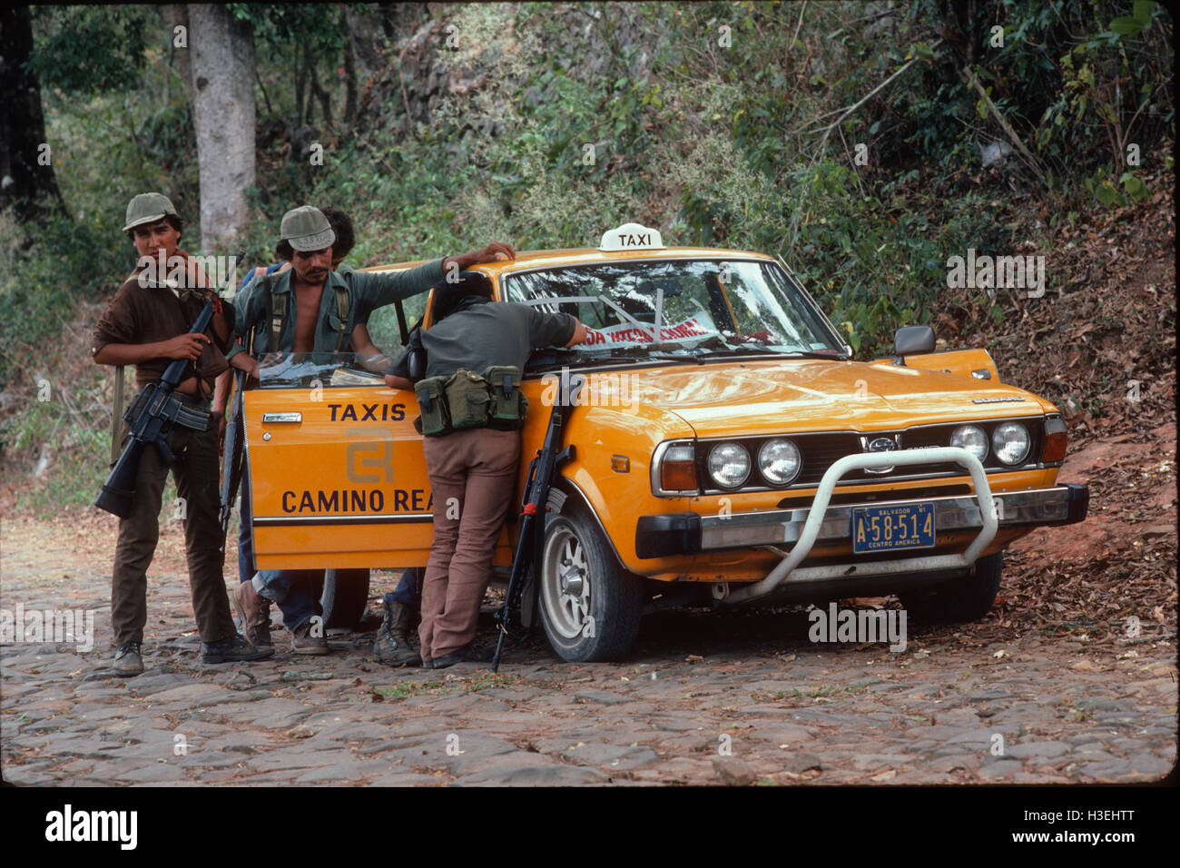 TENANCINGO,  EL SALVADOR, MARCH 1984: - Within the FPL Guerrilla's Zones of Control.  A taxi from San Salvador brings a passenger into the contested town. Stock Photo