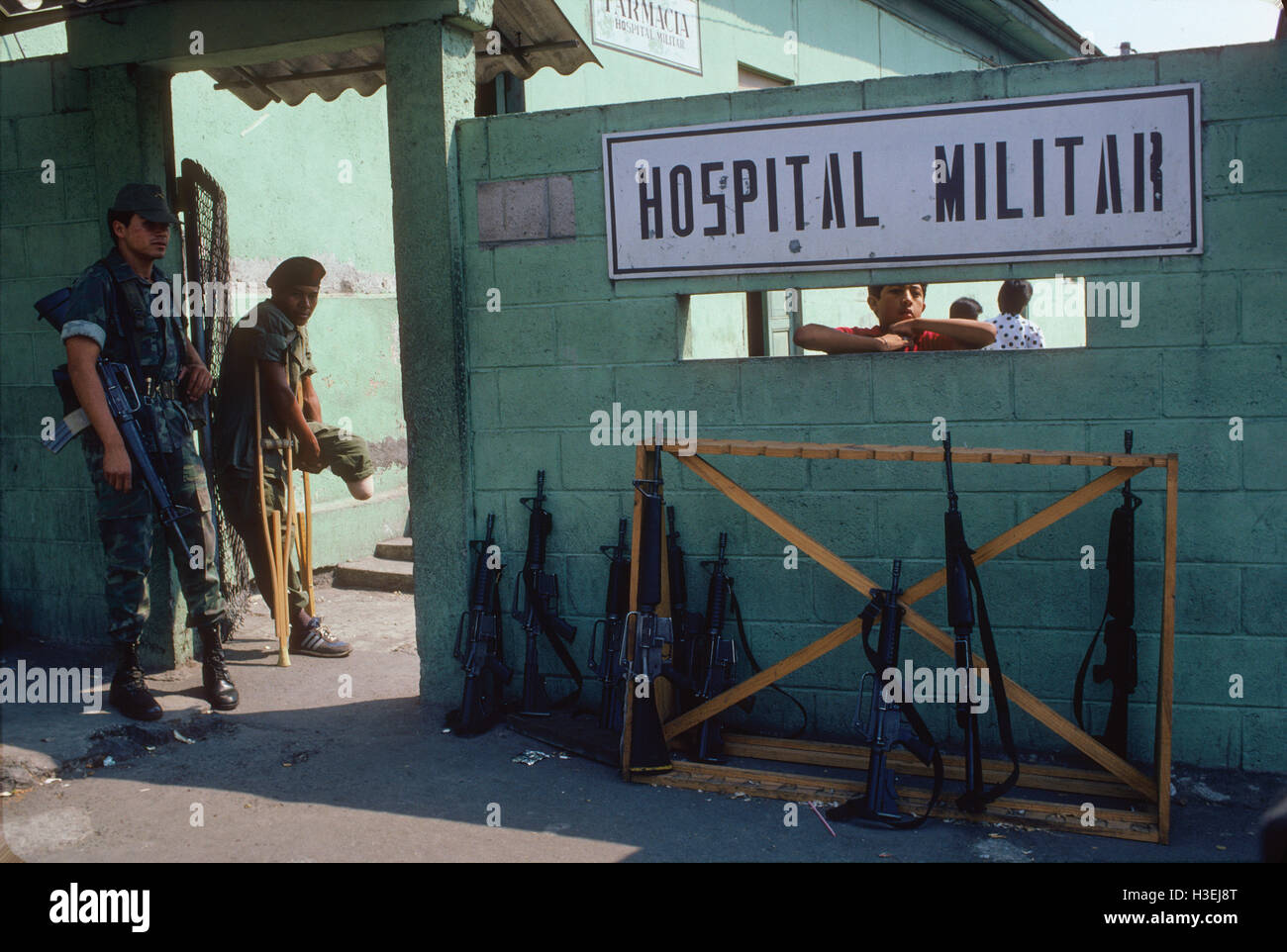 SAN SALVADOR, EL SALVADOR, MAY 1986: A Salvadoran soldier who has had a foot blown off by a mine prepares to leave the military hospital.   The F.M.L.N. guerillas are making increasing use of home-made plastic mines.   Photo by Mike Goldwater Stock Photo