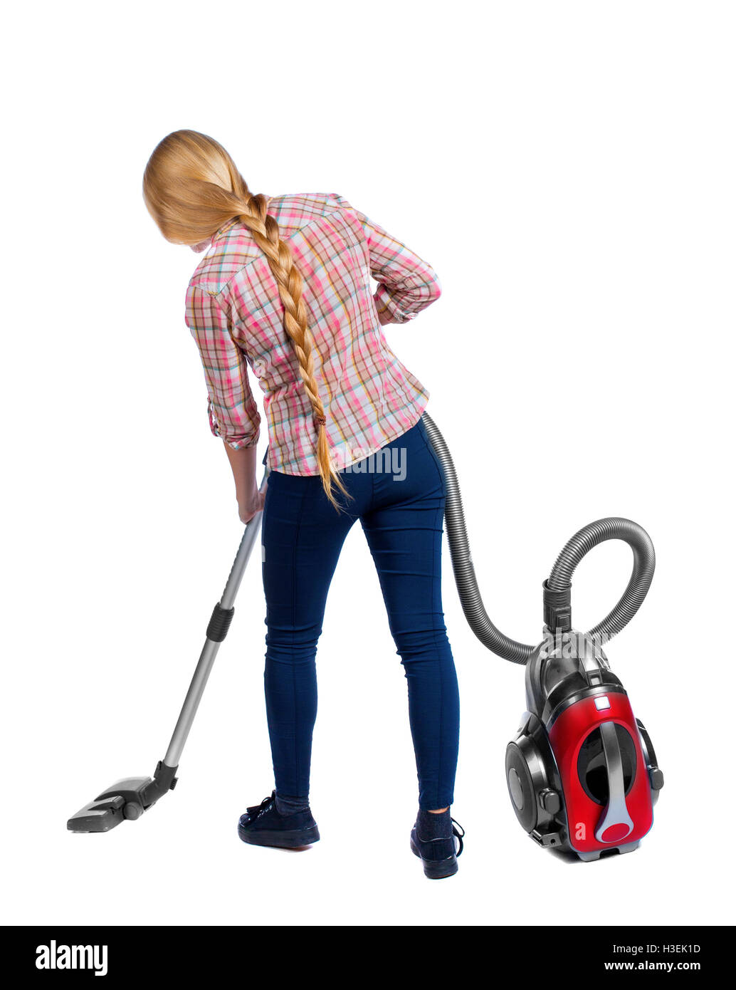 Rear view of a woman with a vacuum cleaner. She is busy cleaning. Rear view people collection. backside view of person. Isolated over white background. Long-haired blonde with a vacuum cleaner. Stock Photo