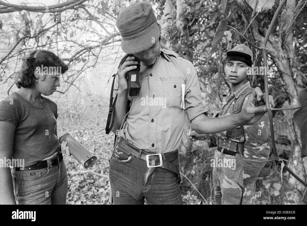 GUAZAPA, EL SALVADOR, FEB 1984: - Within the FPL Guerrilla's Zones of Control -  Women guerrilla radio operator helps FPL compbat units keep in contact. Stock Photo