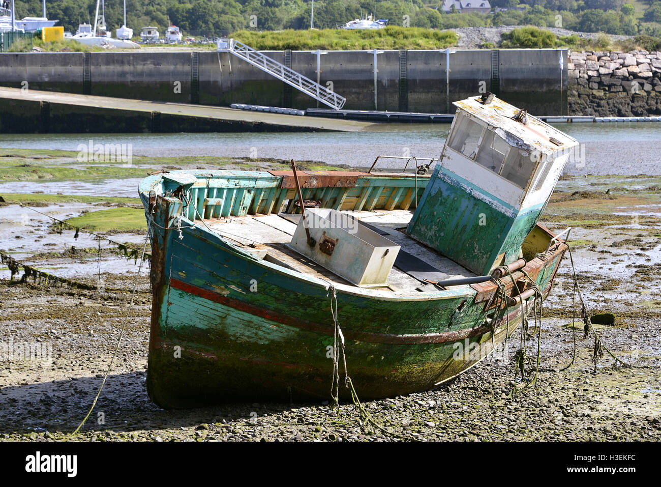Ship wreck in the harbor of Paimpol, a commune in the Côtes-d'Armor department in Brittany in northwestern France Stock Photo