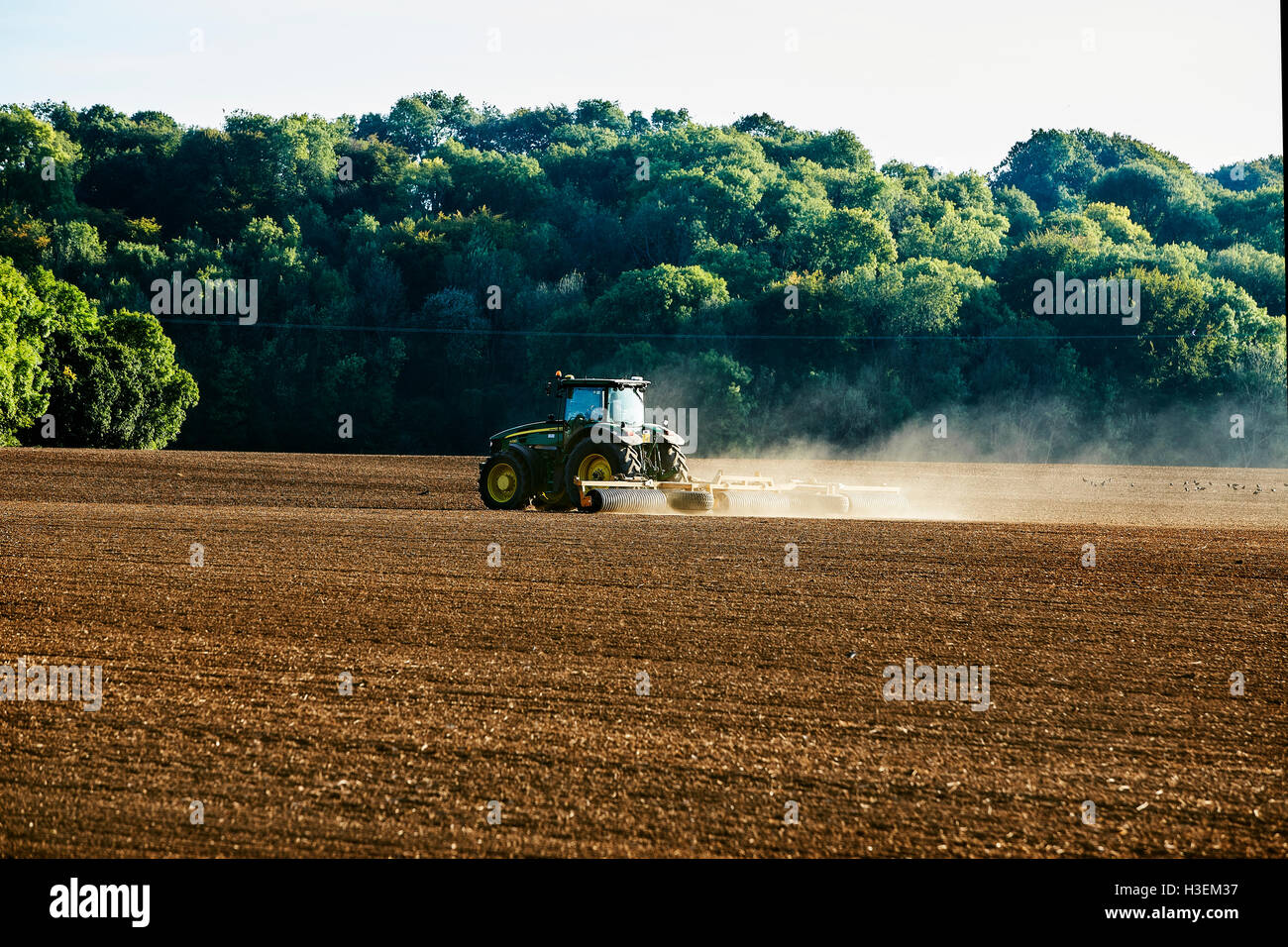 October 2016. Near Soberton Hampshire UK .A Tractor  Working On The Land Stock Photo