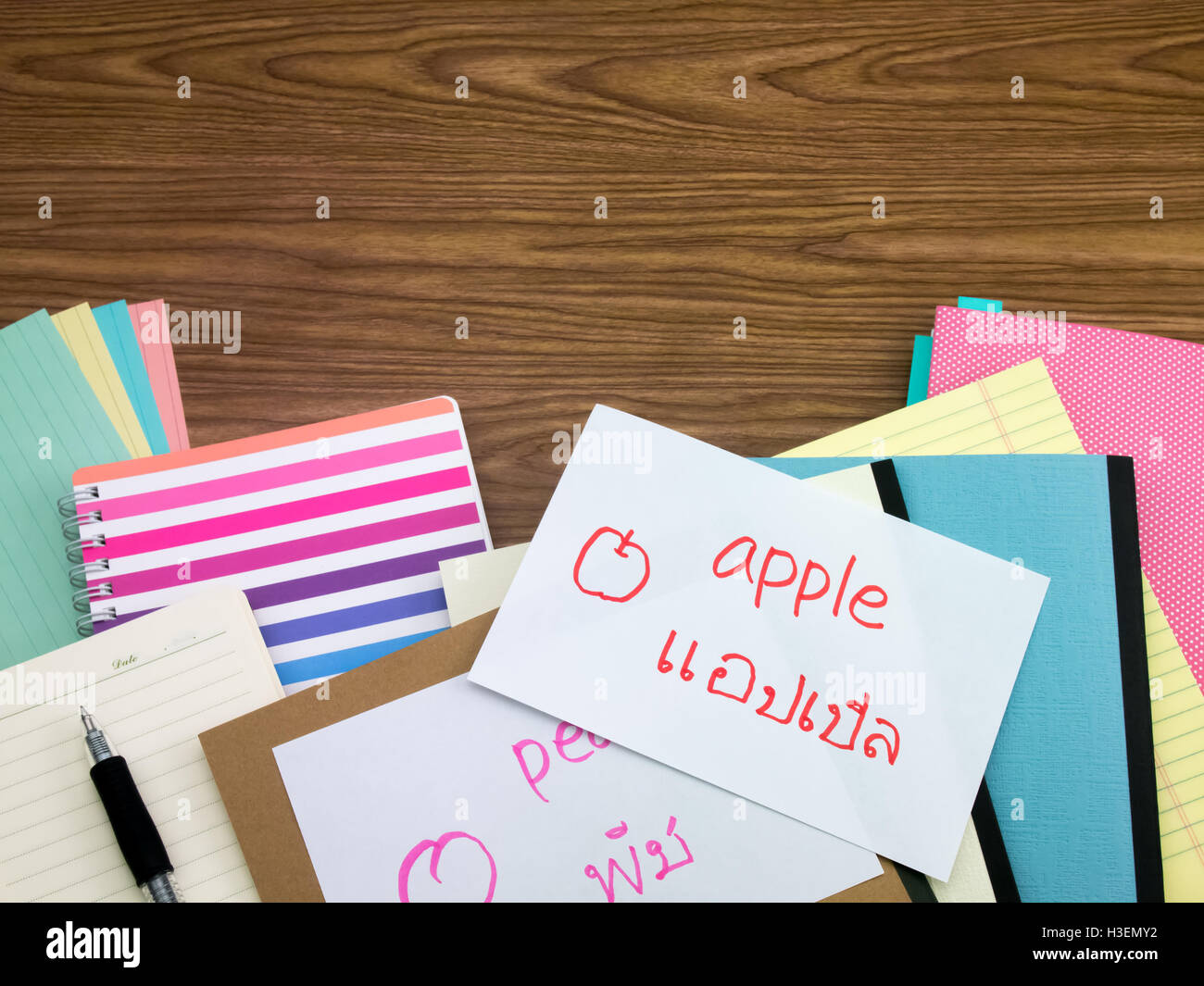 Thai; Learning New Language Writing Words on the Notebook Stock Photo