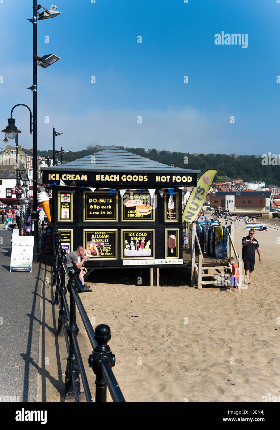 Holidaymakers Relaxing on the South Bay Beach in Scarborough North Yorkshire England United Kingdom UK Stock Photo