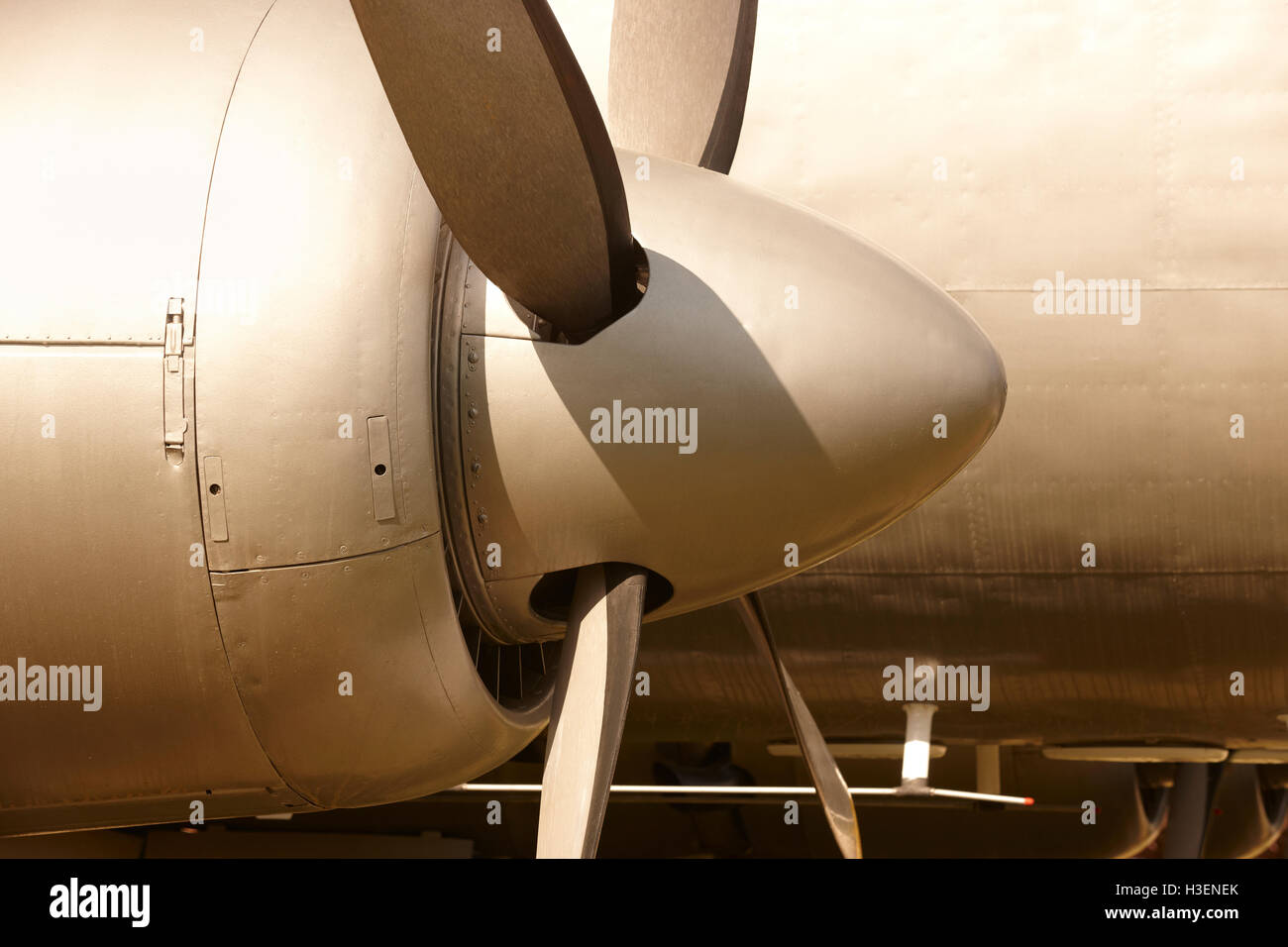 Aircraft propeller engines airframe and blades in warm tone. Horizontal Stock Photo